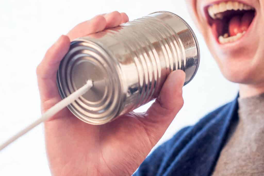 Man talking into Can